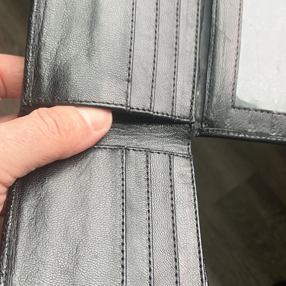 black bifold wallet made from genuine ostrich leather.